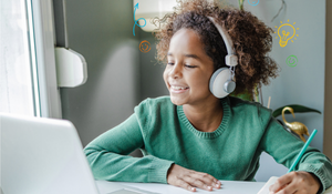 A girl looks at a computer. 